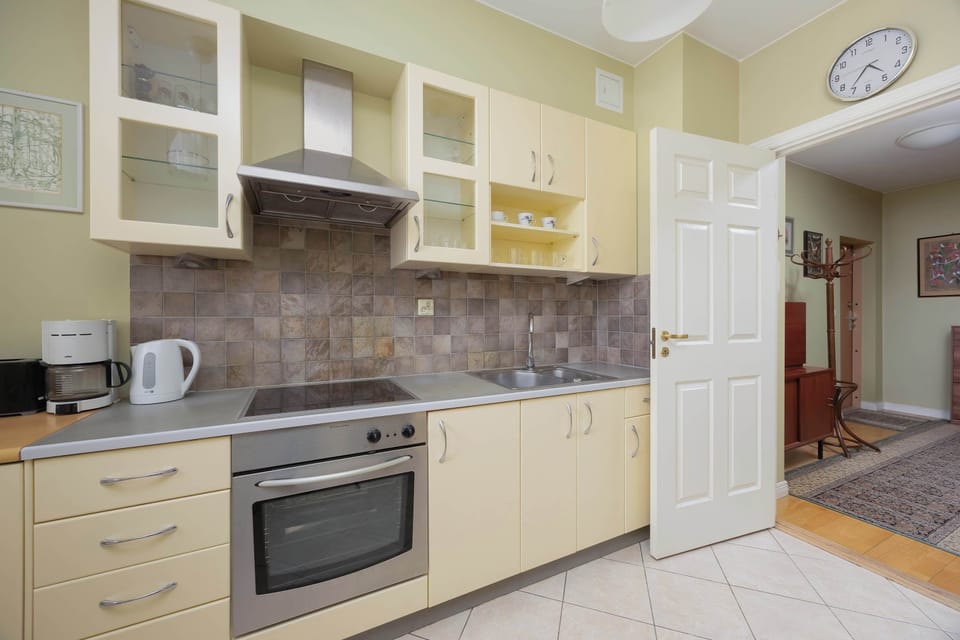 Classic kitchen space combining cooking and dining zones with ample countertop workspace.