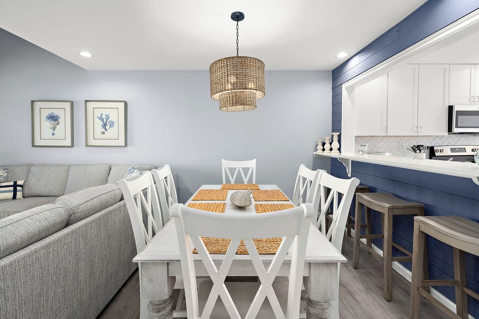 4306 Pettinaro Drive, Bethany Bay - Ocean View - Dining view - Coastal-inspired dining space with a woven light fixture, opening directly into the main living room and kitchen space