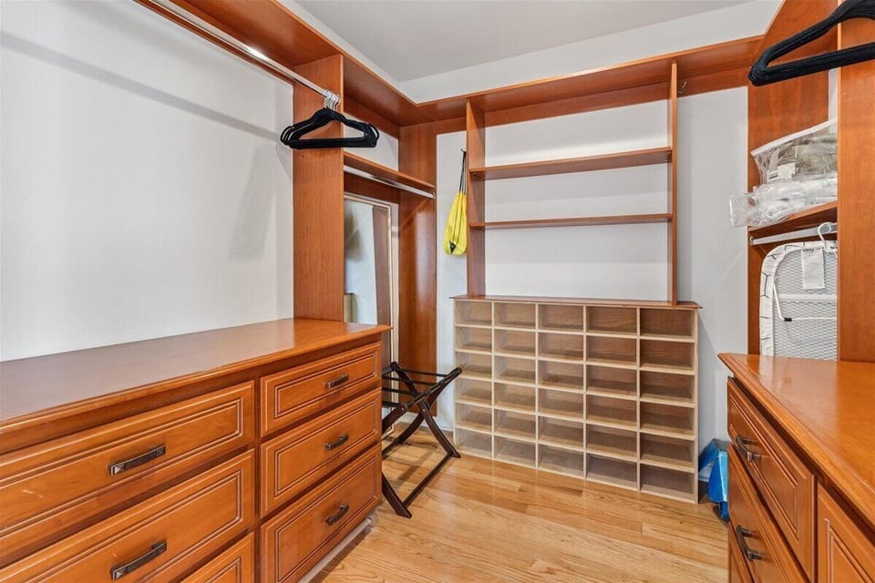 Spacious Walk-In Closet with Built-In Dresser for Bedroom #1