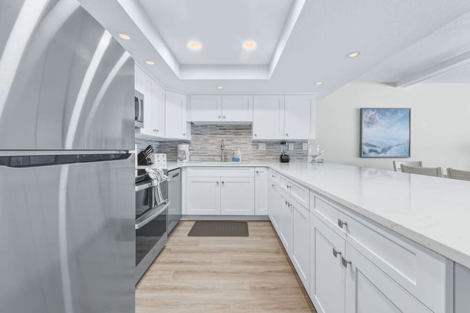 Recessed lighting adds a touch of luxury to the kitchen.
