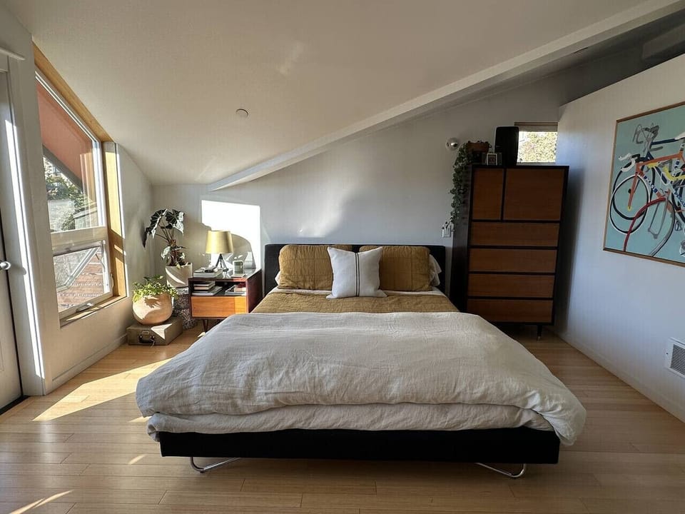 Primary bedroom suite features balcony, ensuite bathroom, walk-in closet and laundry