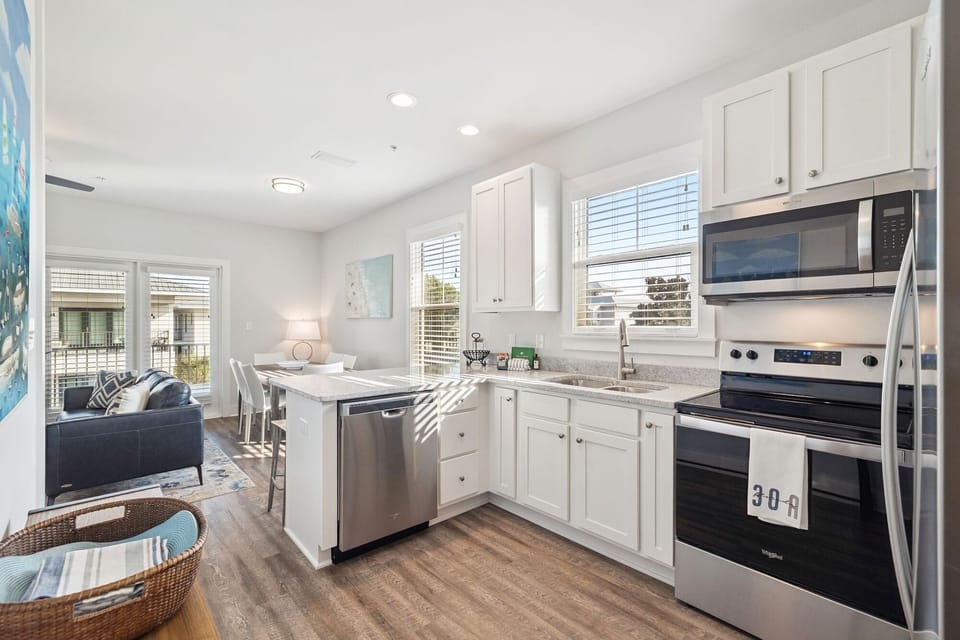Your bright, open kitchen flows seamlessly into the living area, perfect for cooking meals while staying connected with your travel companions.