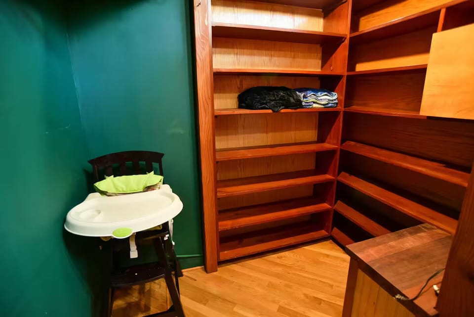 Green bedroom high chair and pak and play