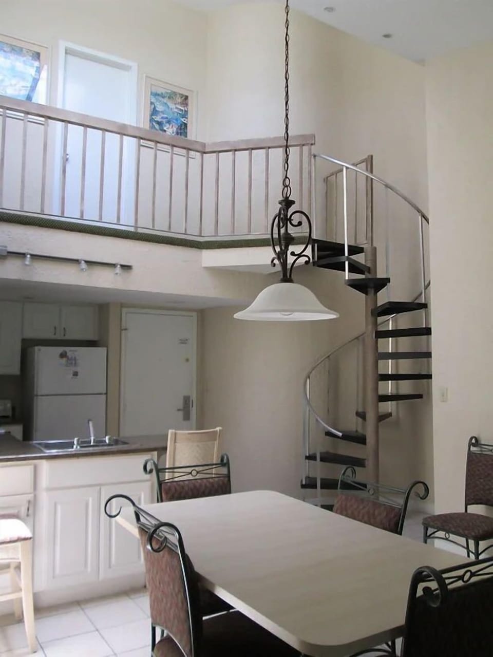 Embrace open-concept living with vaulted ceilings and modern comfort in your loft villa.