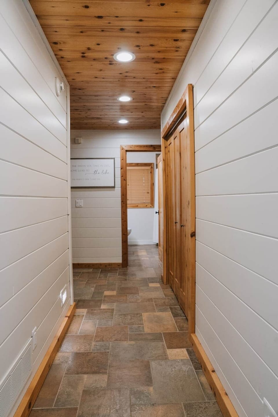 The Main Cabin
The main floor hallway in the main cabin guides you to the laundry closet on the right, bedrooms 2 and 3 on the left, and the main floor bathroom straight ahead.