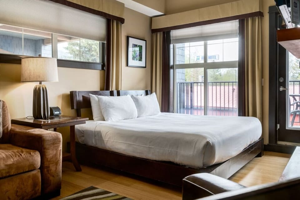 Cozy up on this king size bed. Large windows, light up this beautiful studio.