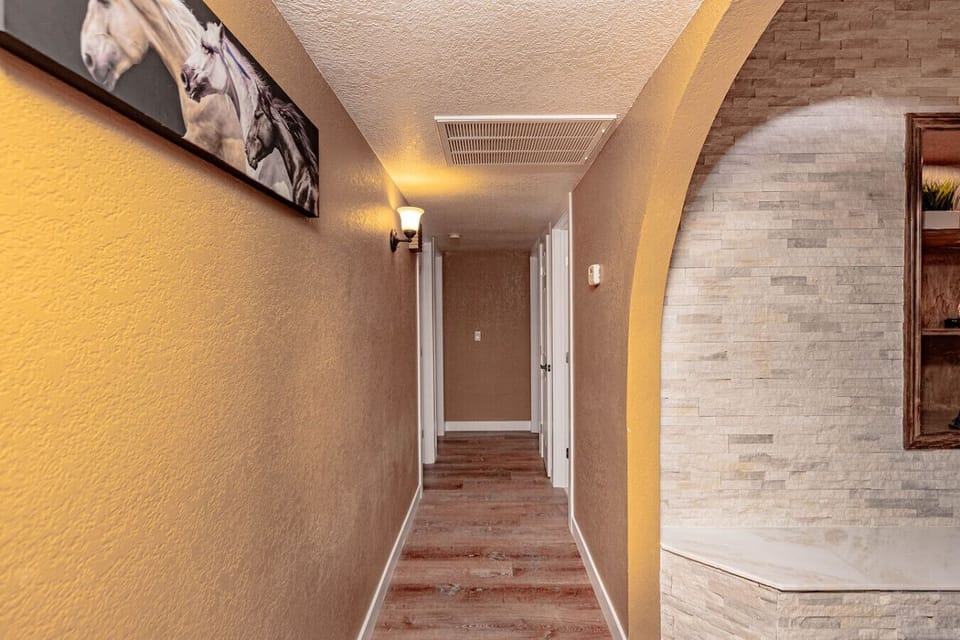 Hallway connecting bedrooms and common areas.