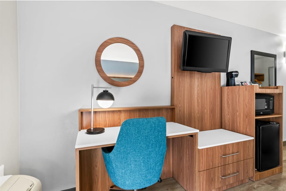 Get productive at the sleek desk with convenient coffee station.