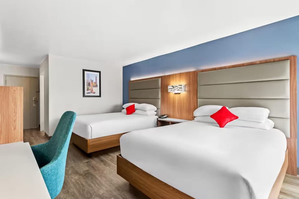 Relax with roomy double beds and warm, modern wood accents.