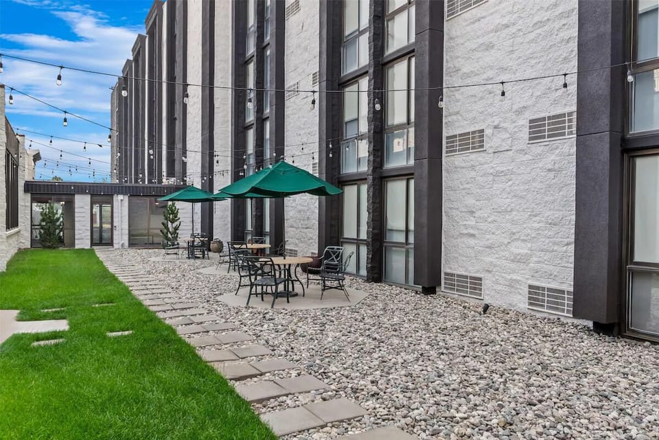Unwind under string lights with shaded courtyard seating.