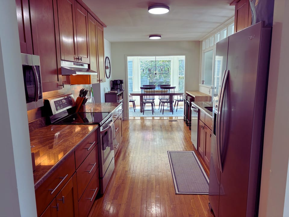 Kitchen and dining room view. Access to lower level from kitchen.