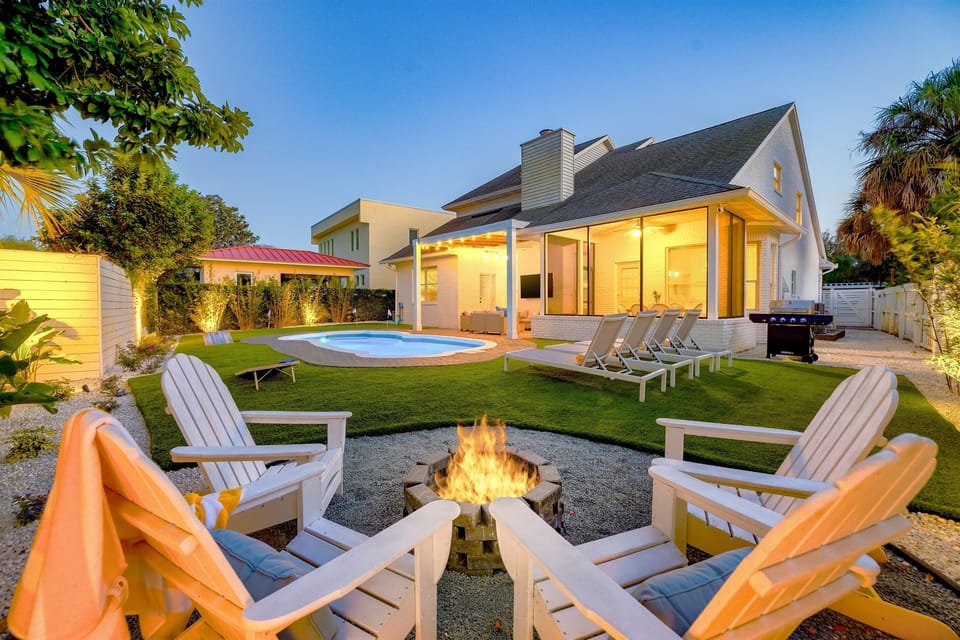 Evenings by the fire, pool lights glowing, and the perfect backyard setup for long conversations under the stars.