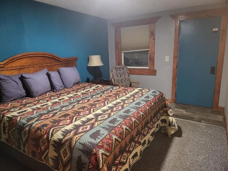 Sink into plush pillows and a warm, rustic quilt.
