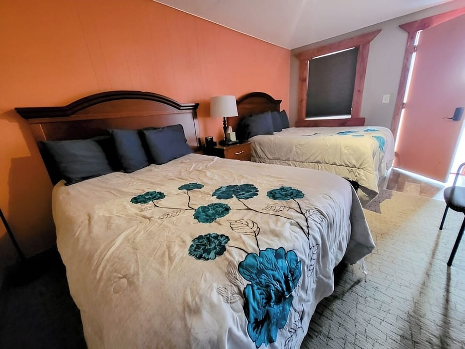 Recharge in a cozy room with warm colors and soft linens.
