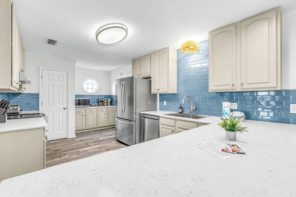 Spacious kitchen, stainless steel appliances, & all the tools to prepare a meal