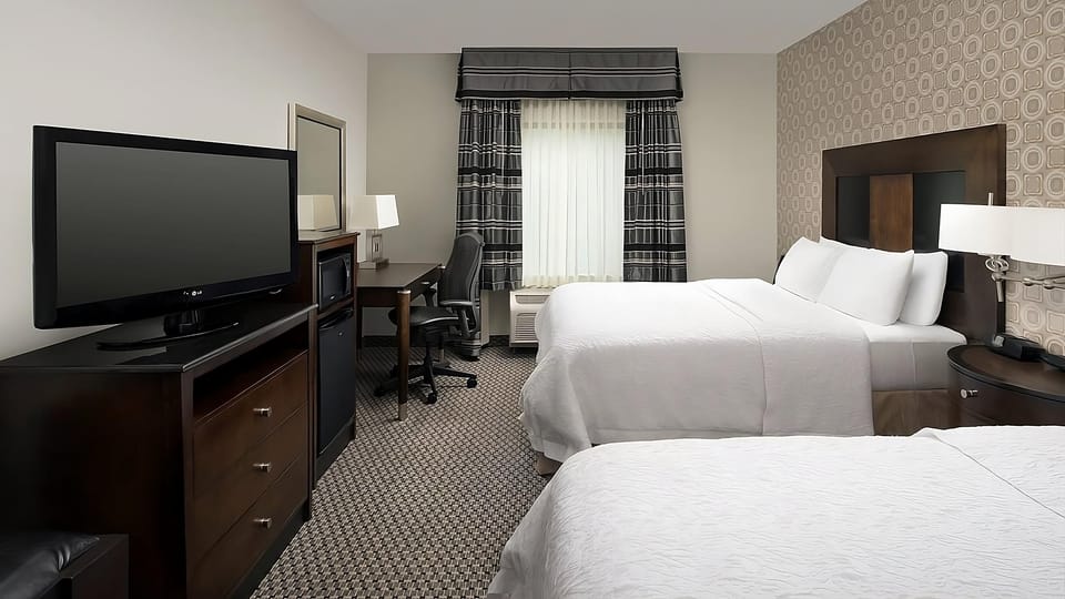 Relax in a bright room with sofa and workspace comfort.