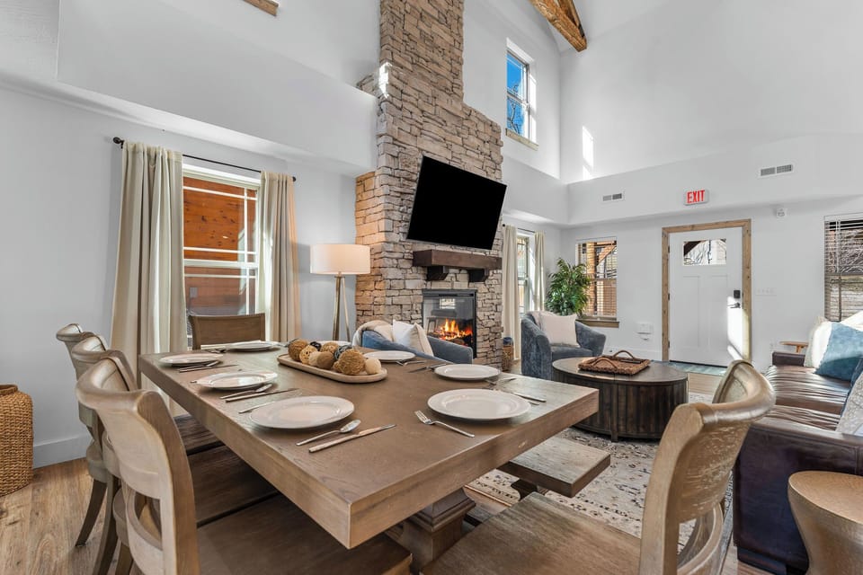 Dining area set beside the fireplace, perfect for shared meals and cozy evenings.