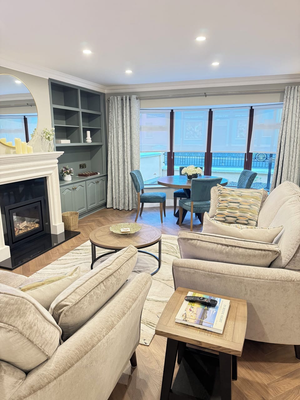 Sitting room with comfortable seating. Large smart tv. Electric fireplace.
