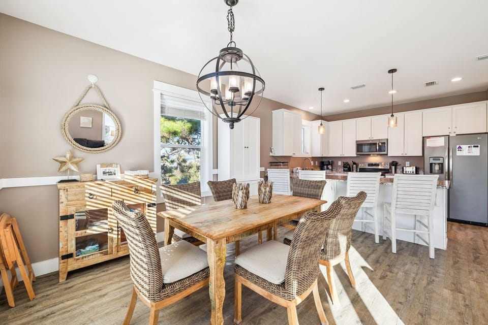 Gather around this beautiful dining table where coastal charm meets modern comfort, perfect for sharing meals and making memories together.
