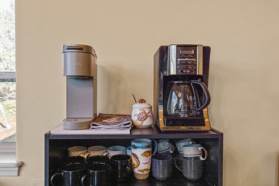 Coffee bar including drip and Keurig coffee. Pods, grounds, creamer, sugar, syrup and sauces included.