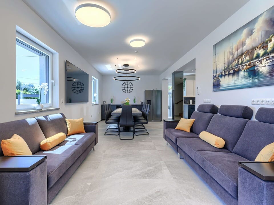 Furniture, Interior Design, Couch, Flooring, Floor, Ceiling, Living Room, Lighting, Table, Room