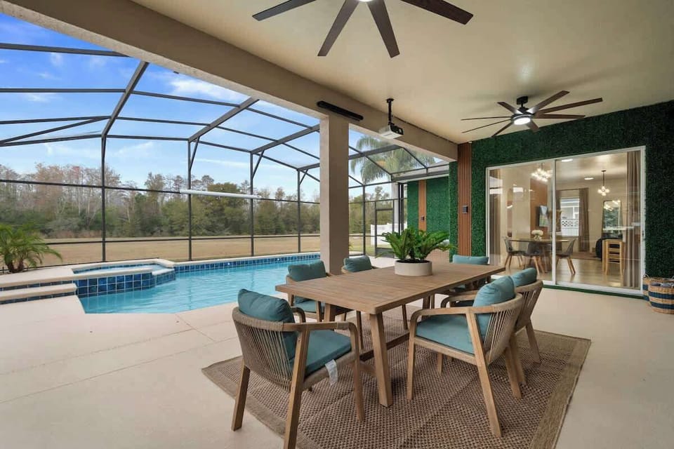 Enjoy unforgettable moments in this poolside space, perfect for friends and family. Fire up the BBQ, share meals at the outdoor dining table, and relax with pool views—an inviting spot for laughter, connection, and lasting vacation memories.