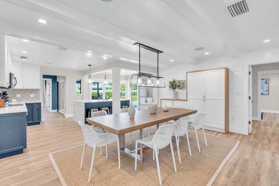 Light Filled Dining Room opens to Kitchen- the Lanai- and Pool. Master BR down the hall to the left of the Kitchen & Guest BR's to right of the Dinning Room.