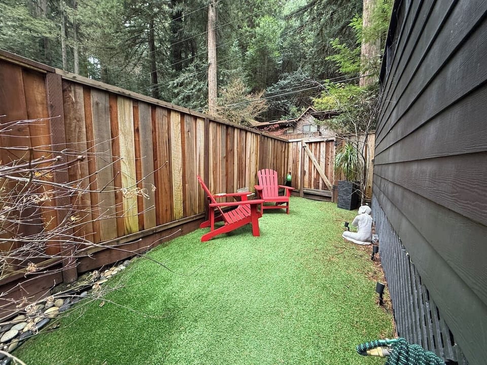 Fenced grassy potty area — pups love their outdoor space just as much as you do.