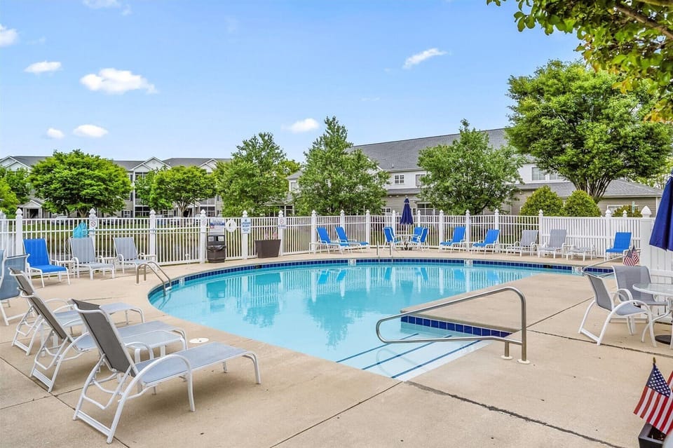 Pool just a few steps from the back stairwell. Outdoor shower & Bathroom too