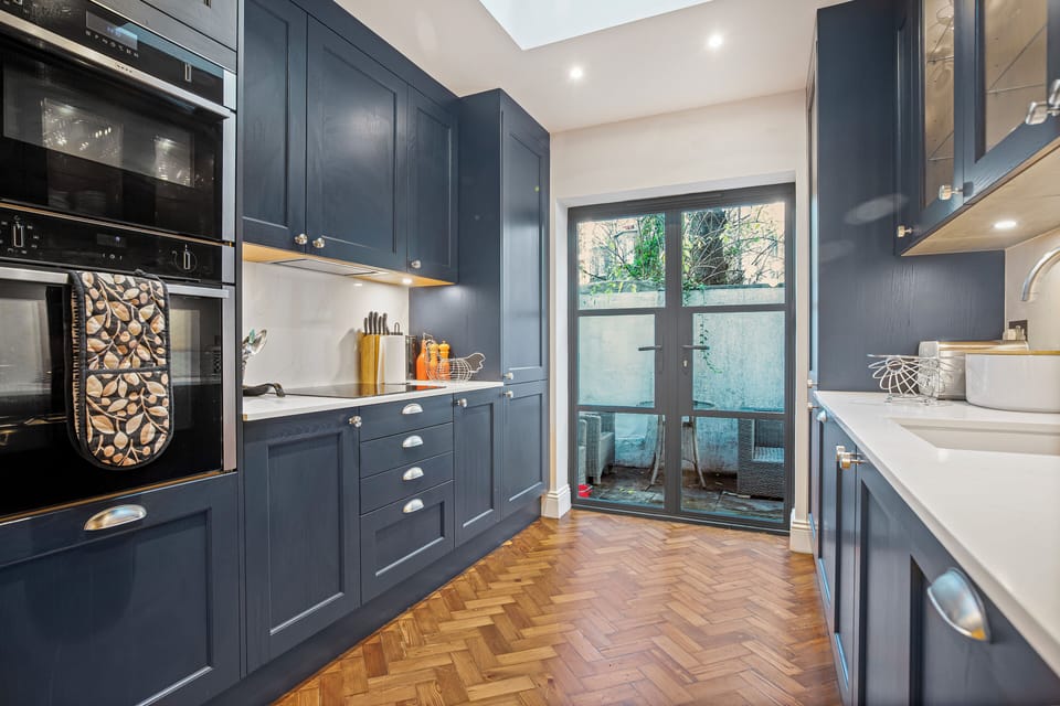 Kitchen with direct access to exterior patio with bbq