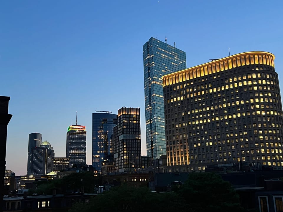 Back Bay Skyline view at night from common roof deck, accessible at any time.