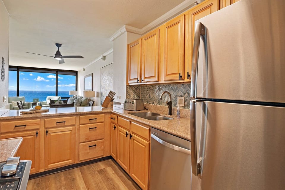 Sleek countertops, stainless steel appliances, and thoughtful touches for a convenient stay