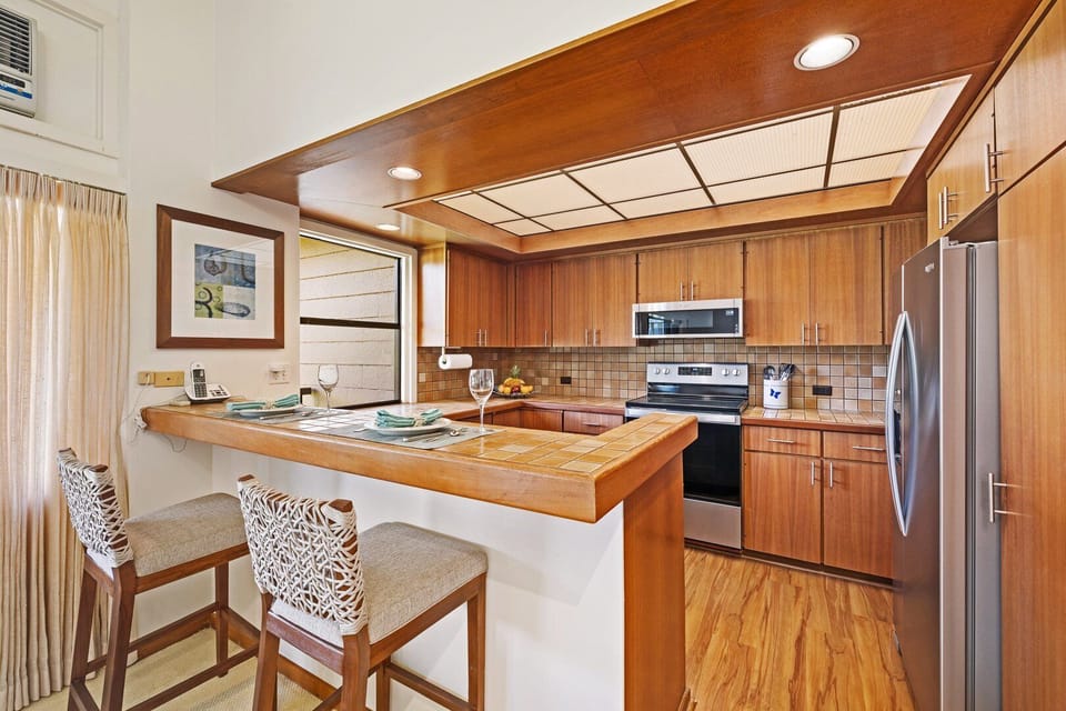 Ideal setup for socializing while preparing meals in a bright, open space