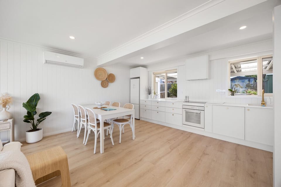 Cook with ease in the bright kitchen, complete with generous bench space, modern appliances and everything needed for preparing meals during your stay.