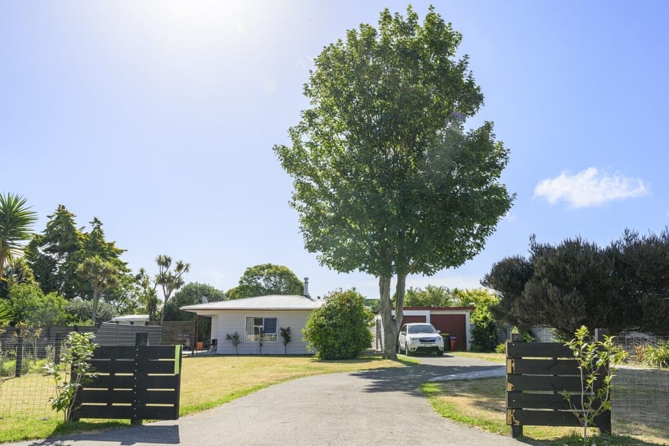 Enjoy your privacy  in a charming beach home with views of a running creek and vast farm fields @AotearoaEscapes