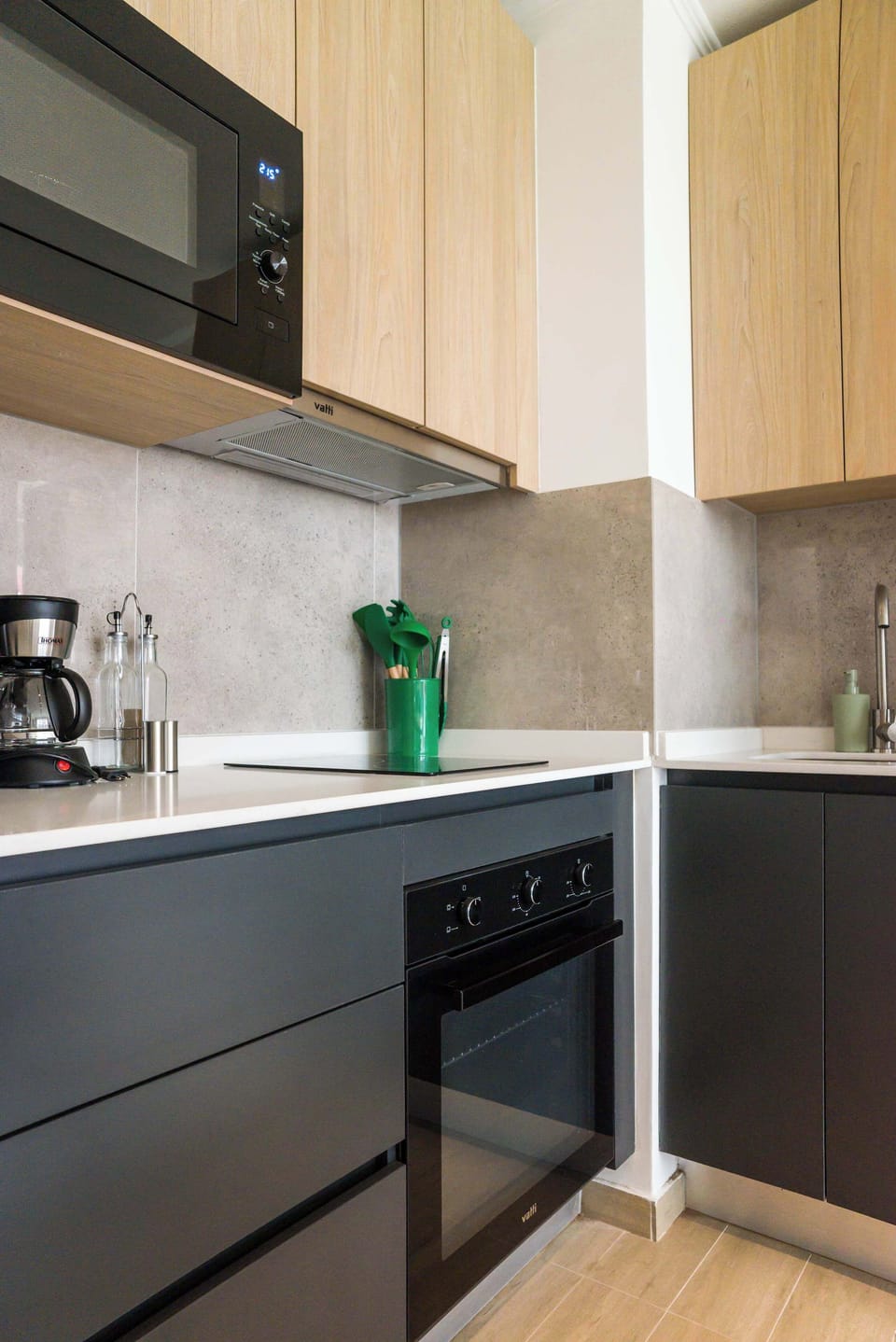 Modern kitchen with sleek appliances and all essentials for a delightful cooking experience.
