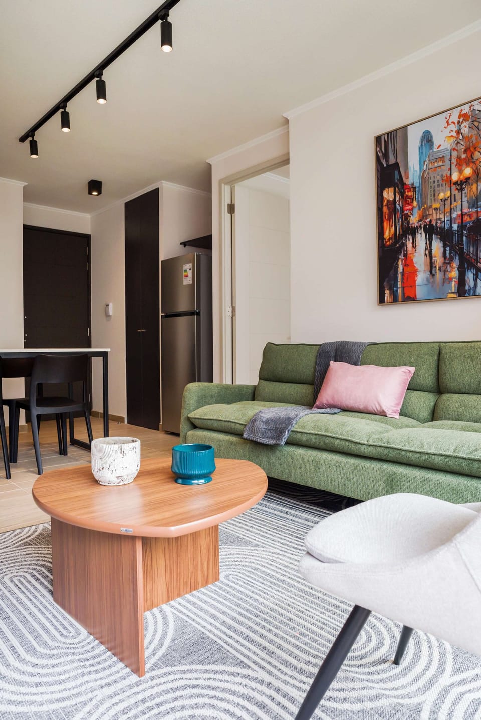 Stylish living area with modern decor and cozy seating, perfect for relaxation.