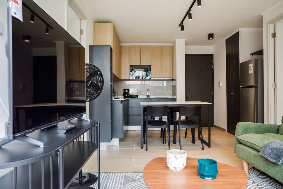 Cozy and modern living space with a fully equipped kitchen and comfortable seating, perfect for relaxing after a day of exploring.