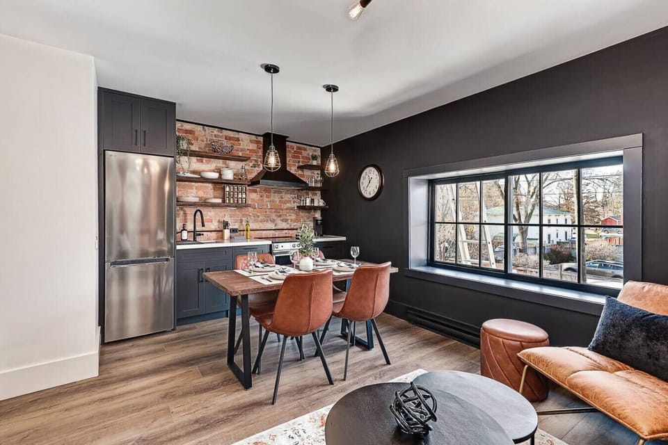 Enjoy meals or morning coffee at the restored-wood dining table - a beautiful piece crafted from materials salvaged from the original heritage structure.