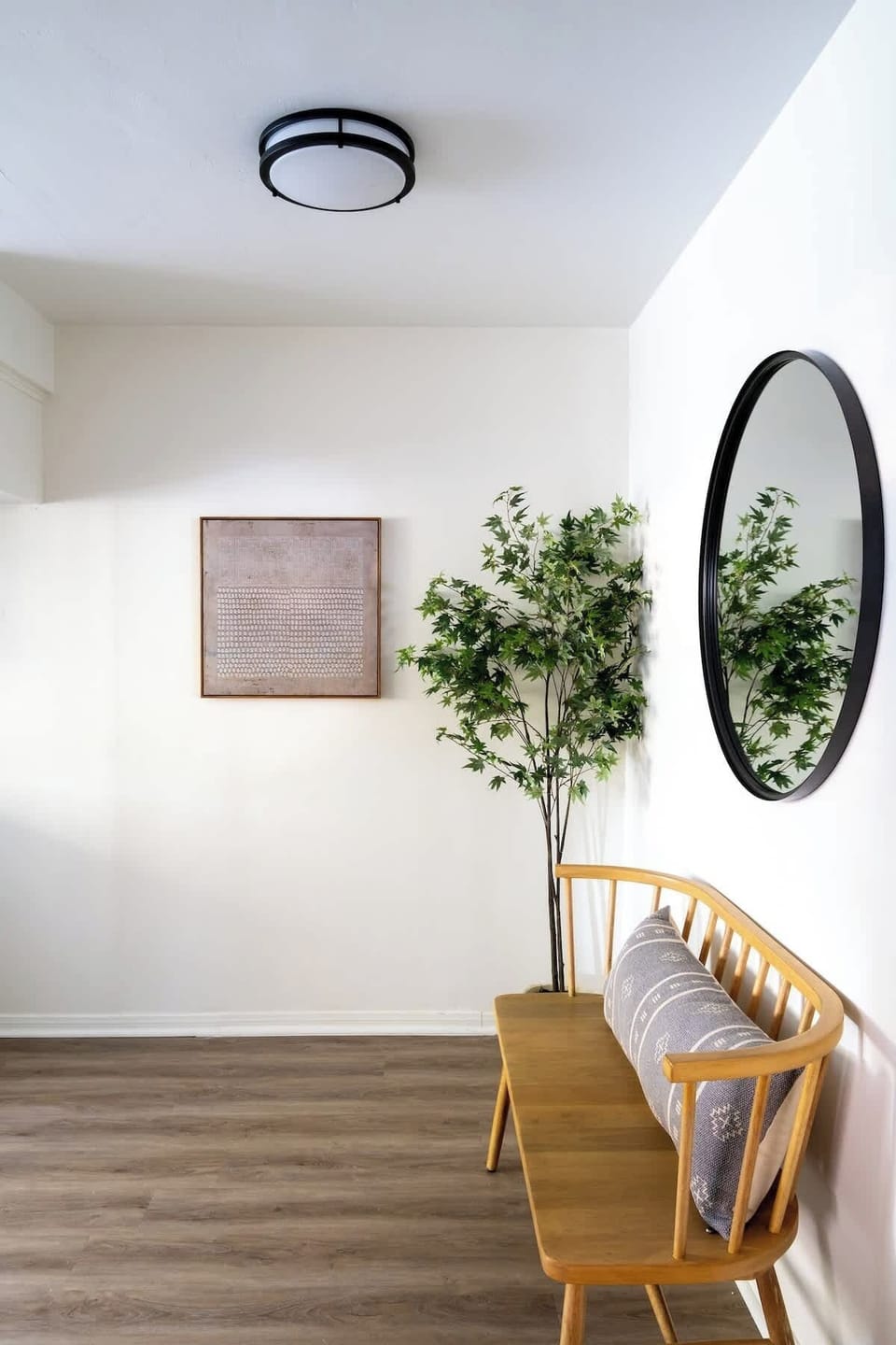 The front entry welcomes you to sit, take off your shoes and make yourself at home