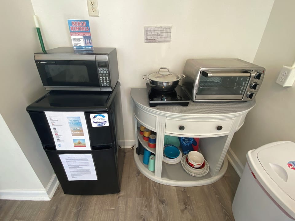 Your kitchenette features a microwave, mini-fridge, toaster oven, and all the dishes you need for convenient meals.