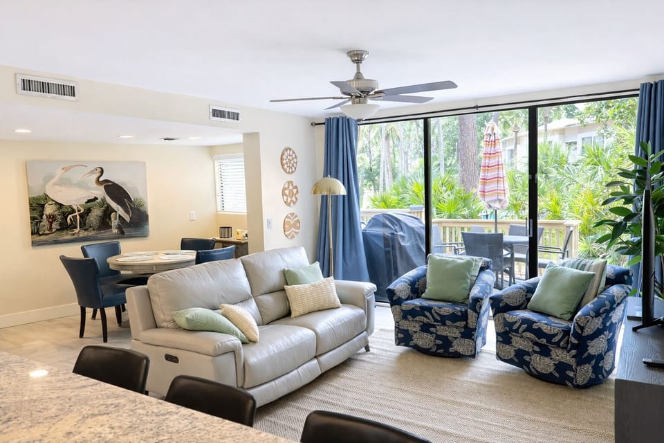 Living room with patio and pool access