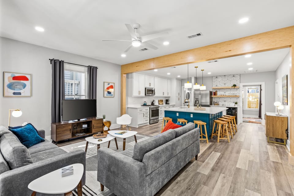 A focal point of the living room is the large wood beam that frames the space. 