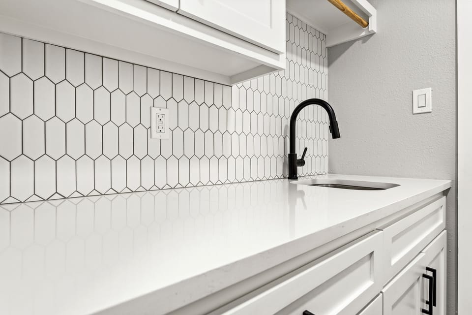 Laundry room sink for your convenience. 