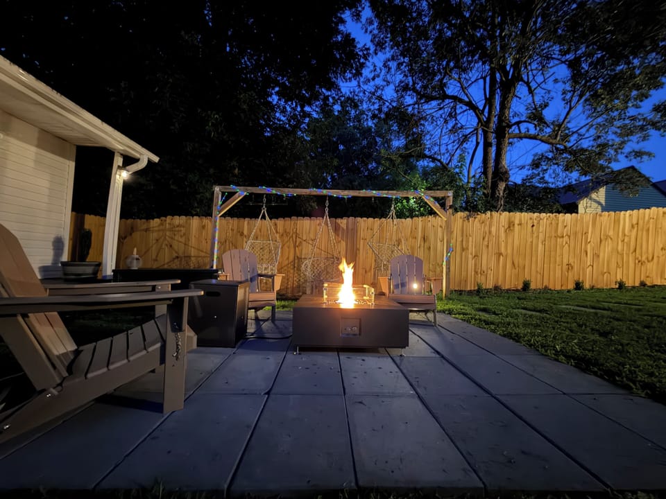 Gather around the fire pit with Adirondack seating and relaxing hanging chairs.