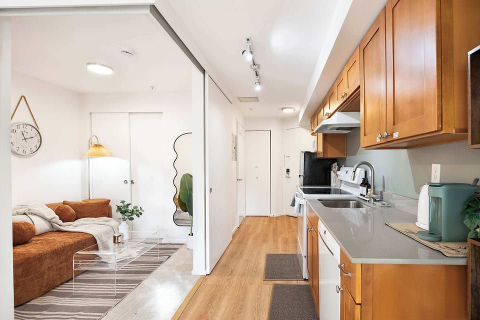 Prep meals in the fully stocked kitchen, then settle into the cozy sofa just steps away—perfect for easy, laid-back days.