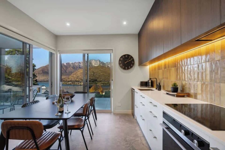 Our modern kitchen features all the appliances and cooking utensils you would expect... with some fantastic views of the mountains and lake!
