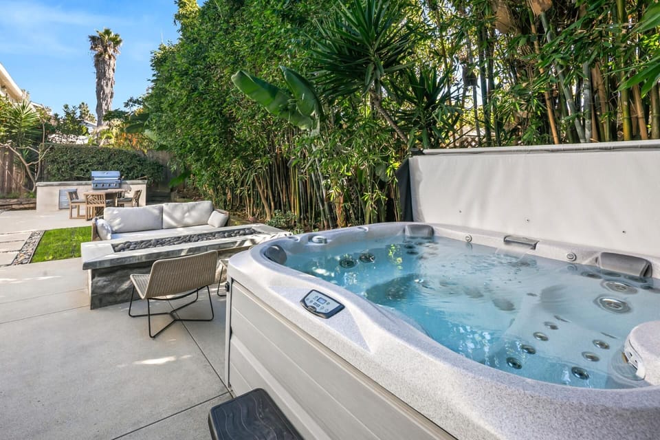 A closer look highlights the spacious hot tub, ready for soothing soaks after beach days.