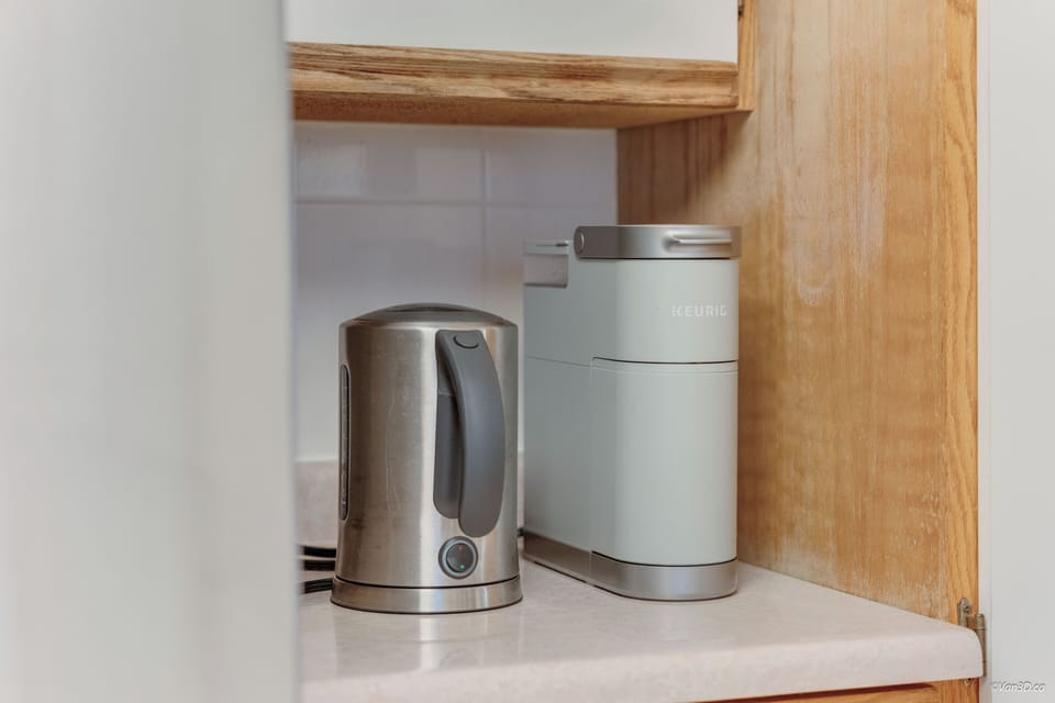 Coffee + tea station with kettle and essentials provided.