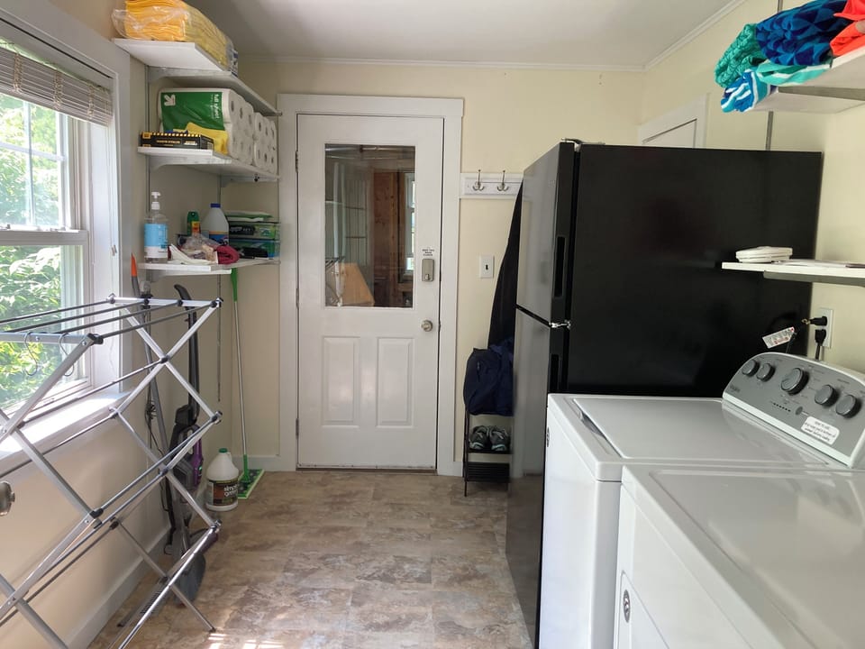 The laundry room has a full-size washer and dryer as well as the refrigerator